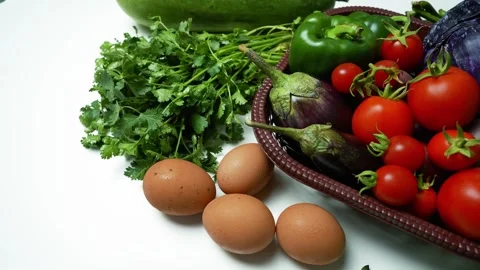 Fresh Vegetables and Eggs on White Surface Footage, A basket filled with fr.. 動画素材 305032994