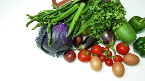 Fresh Vegetables and Eggs on White Background, A variety of fresh vegetable.. Stock Footage 305045205
