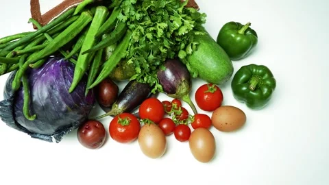 Fresh Vegetables and Eggs on White Background, A variety of fresh vegetable.. 動画素材 305045259
