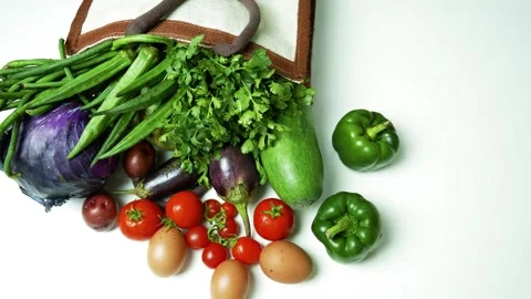 Fresh Vegetables and Eggs on White Background, A variety of fresh vegetable.. Vídeos de archivo 305045328