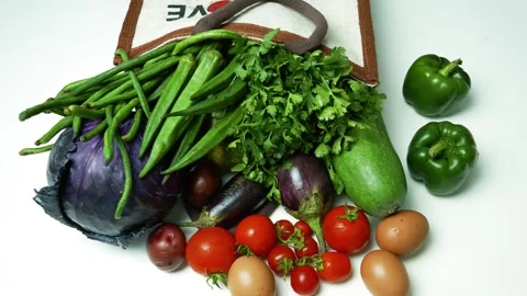 Fresh Vegetables and Eggs on White Background, A variety of fresh vegetable.. 스톡 동영상 305045546