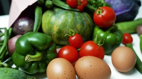 Fresh Vegetables and Eggs on White Surface Footage, A variety of fresh vege.. Vídeos de archivo 305054500