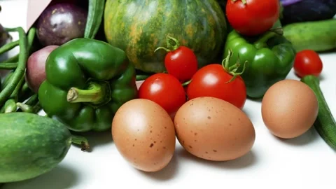 Fresh Vegetables and Eggs on White Surface Footage, A variety of fresh vege.. 库存影片 305054533