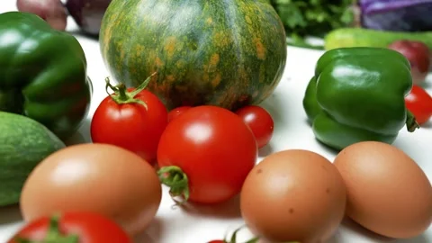 Fresh Vegetables and Eggs on White Surface, A variety of fresh vegetables a.. Stock Footage 305060261