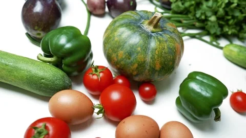 Fresh Vegetables and Eggs on White Surface, A variety of fresh vegetables a.. Vídeos de archivo 305060326