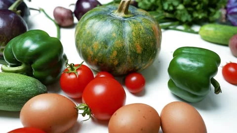 Fresh Vegetables and Eggs on White, A collection of fresh vegetables and eg.. Stockbeeldmateriaal 305060497
