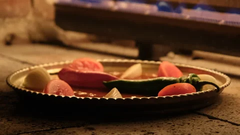 Fresh vegetables and meat sauce cooking in a hot tandoor oven Stock Footage 345426400