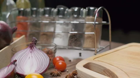 Fresh vegetables and spice jars on the kitchen table Stock Footage 139739526