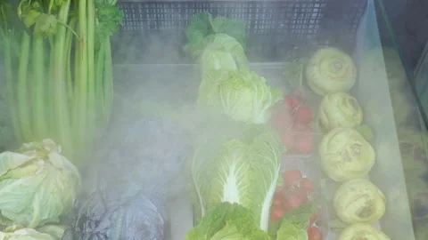 Fresh vegetables are cooled on display Stock Footage 140083920