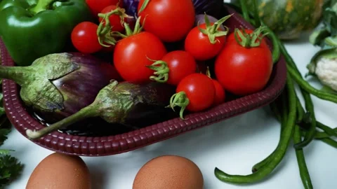 Fresh Vegetables Assortment on White Surface, A variety of fresh vegetables.. 動画素材 305033389