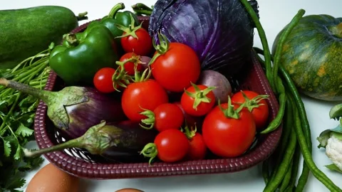 Fresh Vegetables Assortment on White Surface, A variety of fresh vegetables.. Vidéo 305033402