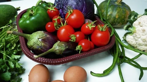 Fresh Vegetables Assortment on White Surface, A variety of fresh vegetables.. Video stock 305033421