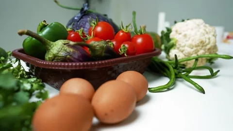 Fresh Vegetables Assortment on White Surface, A variety of fresh vegetables.. 動画素材 305033444