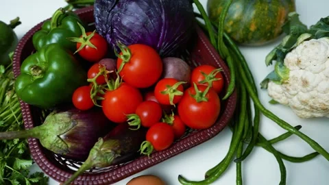 Fresh Vegetables Assortment on White Surface, A variety of fresh vegetables.. 動画素材 305033477