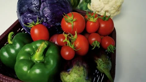 Fresh Vegetables in a Basket, A close-up of fresh vegetables including toma.. Vídeos de archivo 305029654