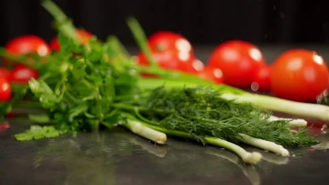 Fresh vegetables being including tomatoes, green onions, parsley, and dill Stock Footage 268280240