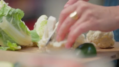 Fresh Vegetables Being Prepared on Cutting Board Vidéo 327334832