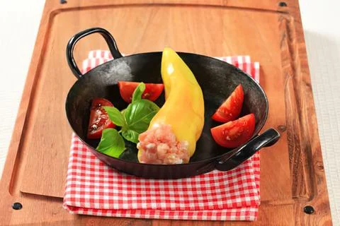 Fresh vegetables in a black pan with checkered cloth Stock Photos