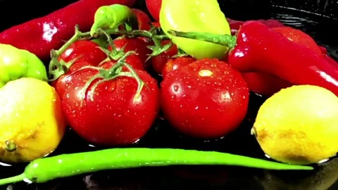 Fresh vegetables close up dolly shoot black background Stock-Footage 75291581