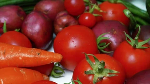 Fresh Vegetables Close-Up with Tomatoes and Carrots, A close-up of fresh ve.. Stock Footage 305031926