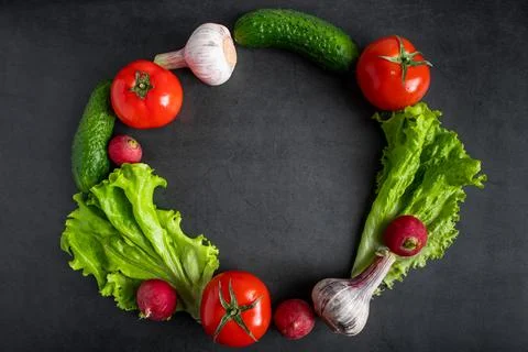 Fresh vegetables on a dark background. The concept of healthy nutrition and.. Fotos Stock