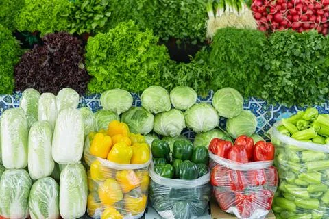 Fresh vegetables displayed at Siab bazaar in Samarkand with colorful bell p.. Photos