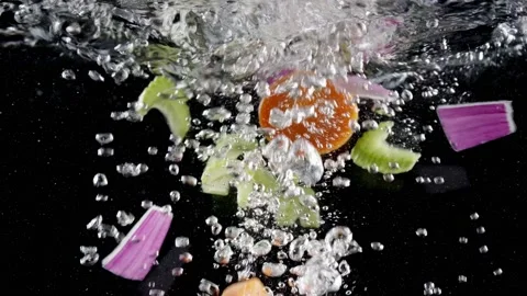 Fresh vegetables falling in boiling water Stock Footage 130876857