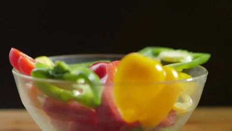 Fresh vegetables falling in an empty glass bowl. 스톡 동영상 69750609
