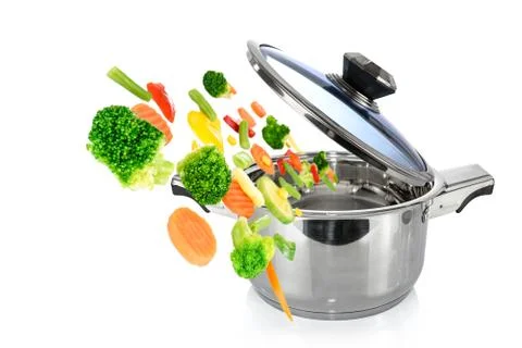 Fresh vegetables falling into a pot Stock Photos