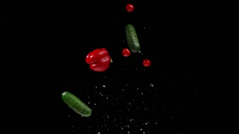 Fresh vegetables fly up and down on a black background for overlay mode Stock Footage 150120013