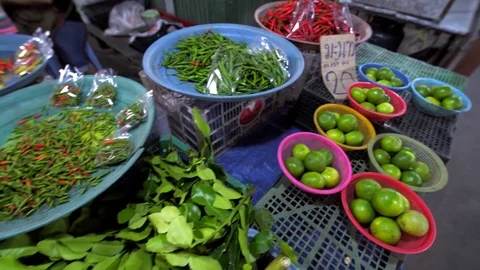 Fresh vegetables, fruit and herbs at night street market in Phuket, Thailand Stock Footage 78561419