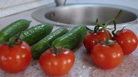 Fresh vegetables on the kitchen table, camera moving back Stock Footage 125973640