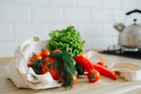 Fresh vegetables in linen bag. Stock Photos