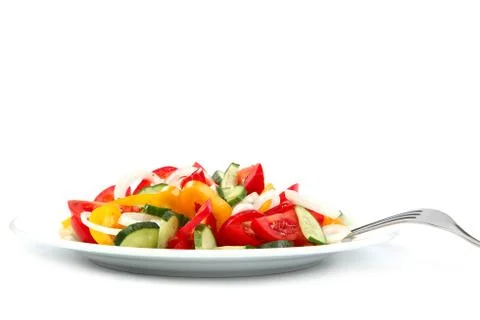 Fresh vegetables on a plate with a fork. Stock Photos