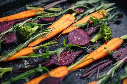 Fresh vegetables for roasting on rustic dark background Foto stock
