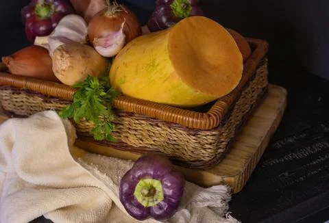 Fresh vegetables on a rustic farm kitchen. Horizontal photo.Dark background Stock Photos