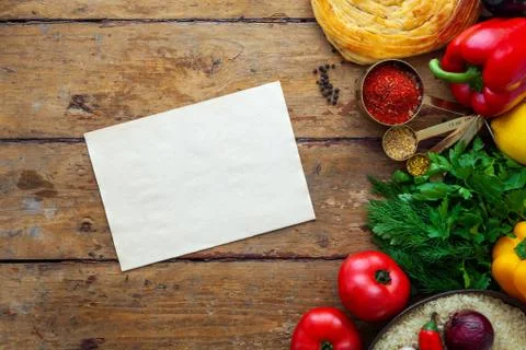 Fresh vegetables on rustic surface with space for your recipe on paper Stock Photos