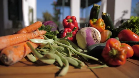 Fresh vegetables on rustic wooden table outdoor Stock Footage 138209157