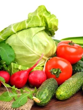 Fresh vegetables on sacking background isolated on white Stock Photos
