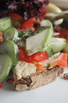 Fresh vegetables on a slice of bread with cheese Stock Photos