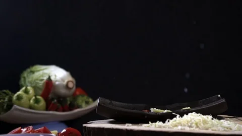 Fresh vegetables slices falling, splashing, slow motion. Stock Footage 77176496