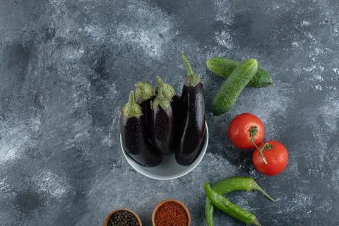 Fresh vegetables with spices on grey background Stock Photos