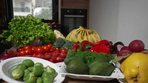 Fresh vegetables still life. Kitchen table with fresh organic fruits and Stock-Footage 169438320