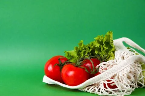 Fresh vegetables in string bag. Sustainable shopping concept. Eco-friendly Stock Photos