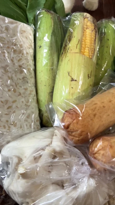 Fresh vegetables tempeh and cooking ingredients haul from traditional local Stock Footage 343886322