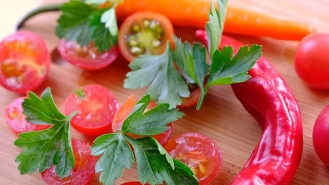 Fresh vegetables: tomatoes, a red pepper and parsley Stock Footage 92793261