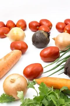 Fresh vegetables on a white background, closeup: Beet, green onions, coriande Stock Photos