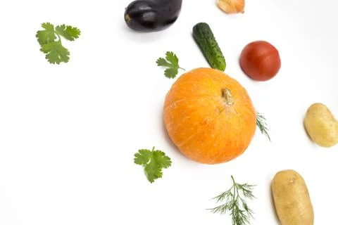 Fresh vegetables on a white background, flat lay: Potatoes, pumpkin, dill, to Stock Photos
