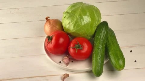 Fresh vegetables on a white plate. Stock Footage 150789584