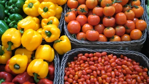 Fresh Vegetables In Wicker Baskets On Counter Of Greengrocery Stock Footage 98475801